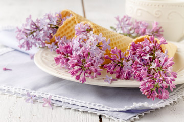 Obraz na płótnie Canvas Romantic gift lilac flowers on table