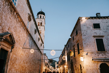 Christmas street decorations on the square of the old city of Dubrovnik in Croatia for the New Year. - obrazy, fototapety, plakaty
