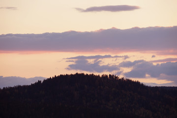 Fototapeta premium Beautiful colorful sky after sunset over mountains.