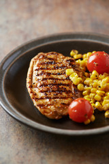 Grilled Turkey Breast on stone background.