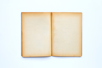 Opened old book isolated on white background.