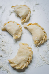 Traditional polish dumplings (called pierogi ruskie) filled with potatoes and cottage cheese. 