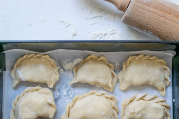 Traditional polish dumplings (called pierogi ruskie) filled with potatoes and cottage cheese. 