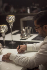 Man writing on a paper