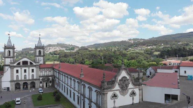 AERIAL DRONE FOOTAGE - The Monastery of St. Benedict (Sao Bento) in the city of Santo Tirso, Portugal, with the Ave River in the background. The Municipal Museum Abade Pedrosa.