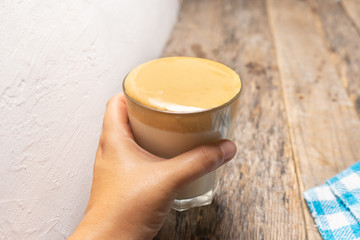 Korean dalgona coffee on wooden background