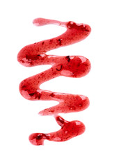 Fototapeta premium Cherry jam drizzle isolated on white background. Splashes of red berry jam. Top view.