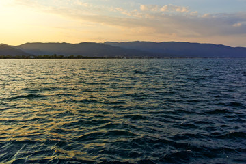 Fototapeta premium Sunset at coastline of village of Stavros, Chalkidiki, Greece