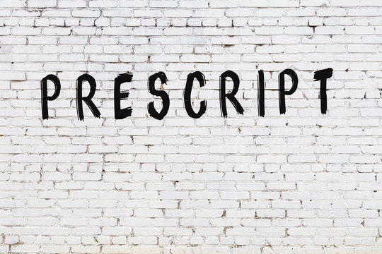 Word prescript painted on white brick wall