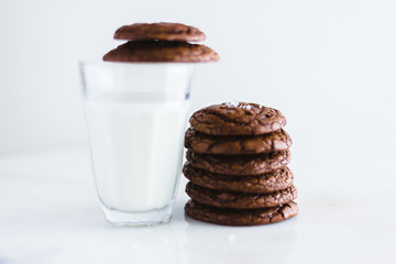 chocolate brownie cookie with glass of milk