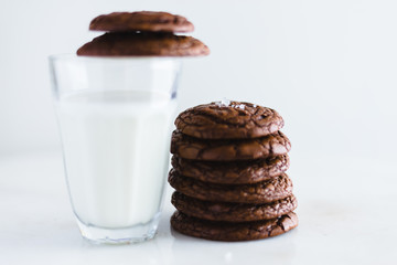 chocolate brownie cookie with glass of milk