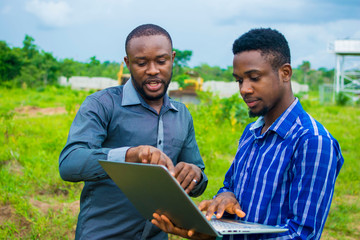 young black men discussing some business plans to be executed on