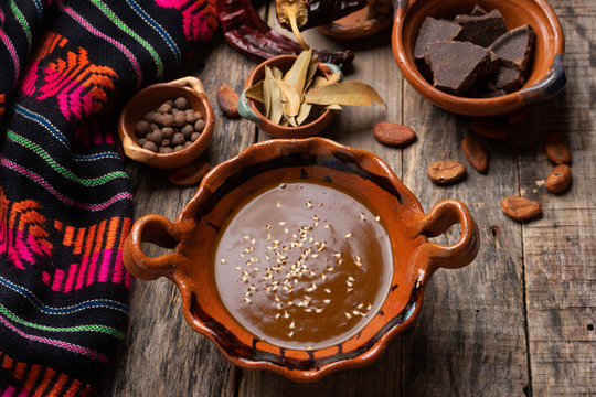 Mexican mole sauce on wooden background