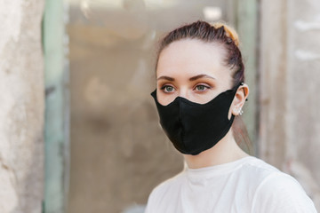 Woman in protective facemask outdoors