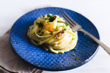 Aglio e Olio pasta in a blue ceramic