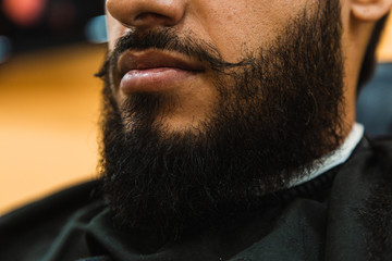 Fototapeta premium Portrait of a bearded man in the barbershop.