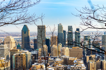 View of the Montreal skyline from mt royal park on a beautiful winter day blue sky and clouds 