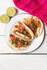 Mexican fish tacos also called Baja with fresh sauce on white background