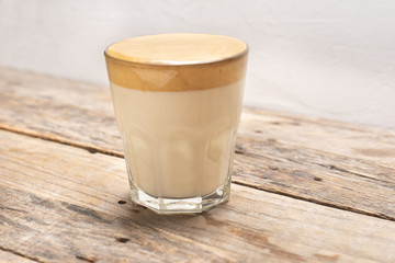 Korean dalgona coffee on wooden background