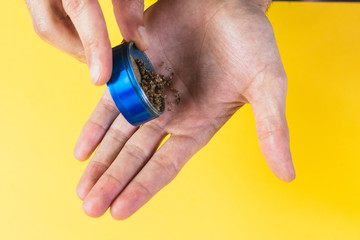 Closeup of a man preparing a marijuana for smoking