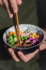 Thai salad on a bowl with chopsticks
