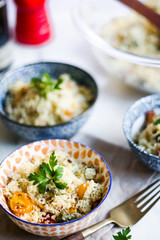 homemade couscous with cherry tomatoes and fresh herbs