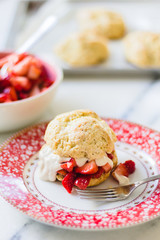 strawberry shortcake with cream on a cute plate