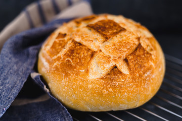 whole sourdough bread with napkin