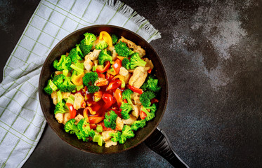 Stir-fry vegetables and chicken with sweet and sour sauce.
