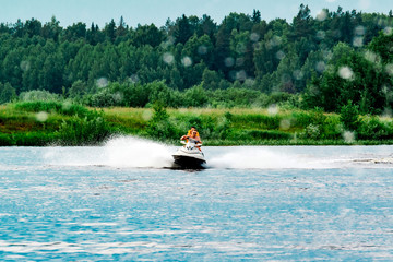 Couple rides a jet ski