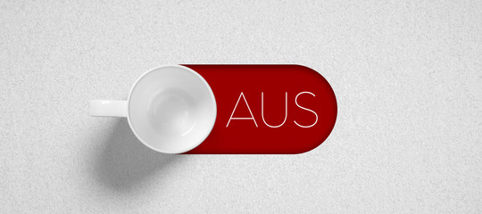 white cup and German word for OFF on paper background