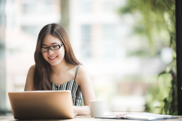 Asian women work at home to avoid the spread of the virus. Modern business practices through online systems and modern technology, work from home lifestyle