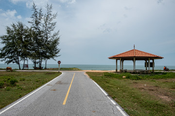 Road by the beach in rural Southern Thailand