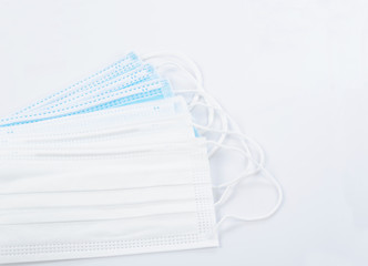 Medical mask or surgical mask with rubber ear straps.