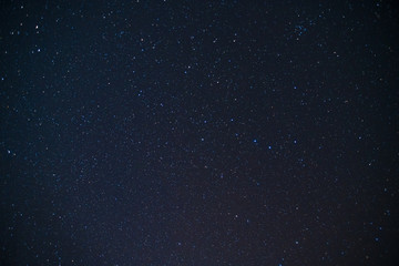 Starry sky, planets and stars, landscape at sunset of the Pacific Ocean