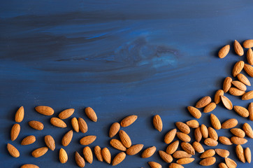 Raw Almond on a blue wood surface