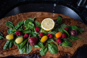 Healthy vegetable salad ingredients with water splashes