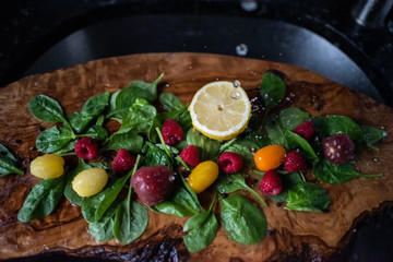Healthy vegetable salad ingredients with water splashes