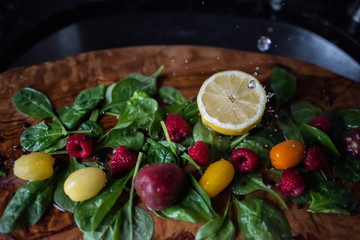 Healthy vegetable salad ingredients with water splashes