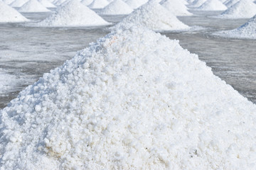 White salt piles on the salt field in Petchaburi province, Thailand.  
