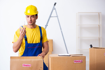 Young male professional mover doing home relocation