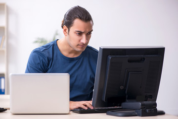 Young male it specialist working in the office