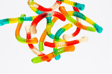 Gummy worms candy on clean white backdrop