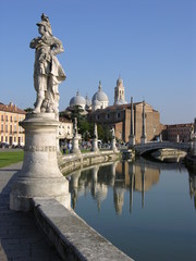 Fototapeta na wymiar Padua, Italy, Prato della Valle with Statue, Canal, and Basilica of Santa Giustina