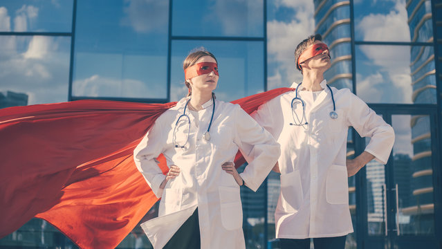 close up. doctors are superheroes standing on a city street .