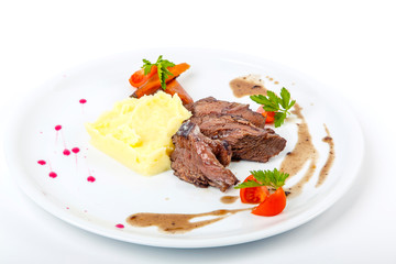 Beef cheeks with mashed potatoes. On white background