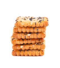 Square poppy seeds and sesame crackers isolated on white background. Dry cracker cookies isolated. Salty snacks isolated.
