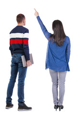 Back view couple with laptop in sweater.