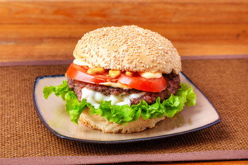 Beef burger on wooden background