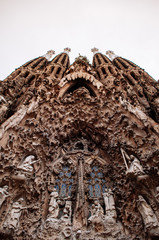 Carved stone sculpture grand facade of La Sagrada Familia Basilica church in Barcelona. Spain